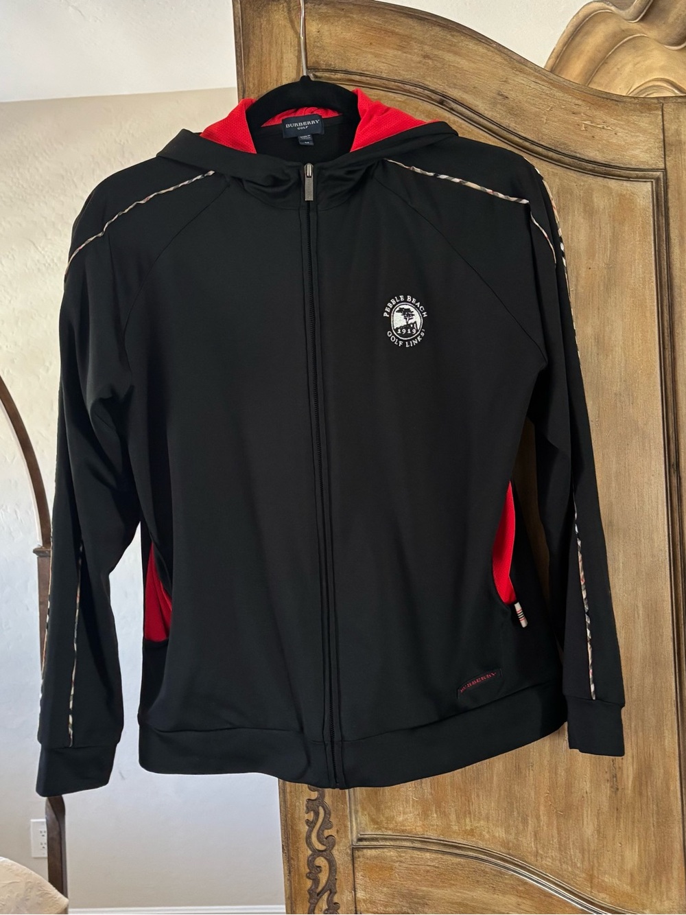 Burberry Black Performance Zip Hoodie with Red Accents & Pebble Beach logo.
